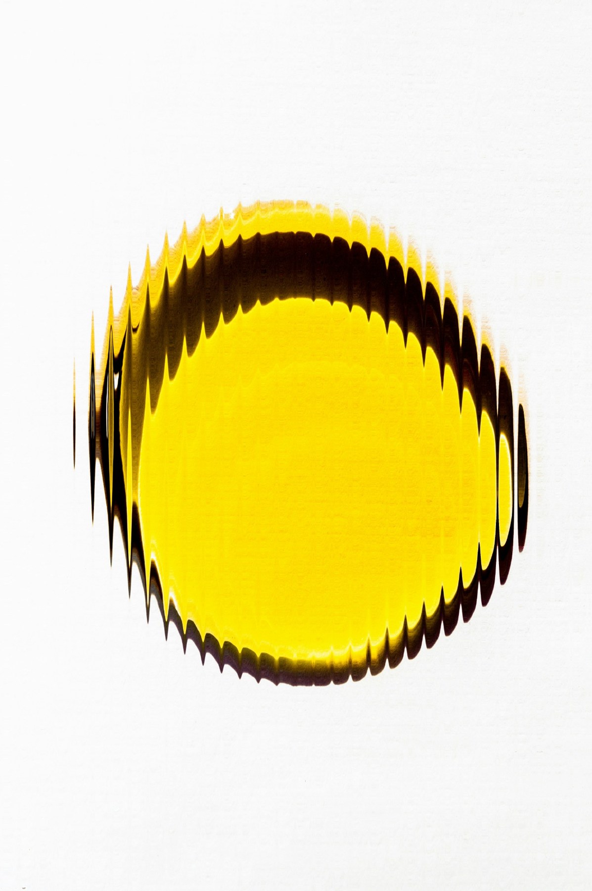 A golden drop of oil on a light background